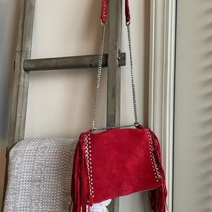 Red tassel purse with silver detailing from Zara in Spain